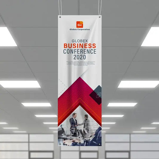 Vertical business conference banner hanging from the ceiling indoors.