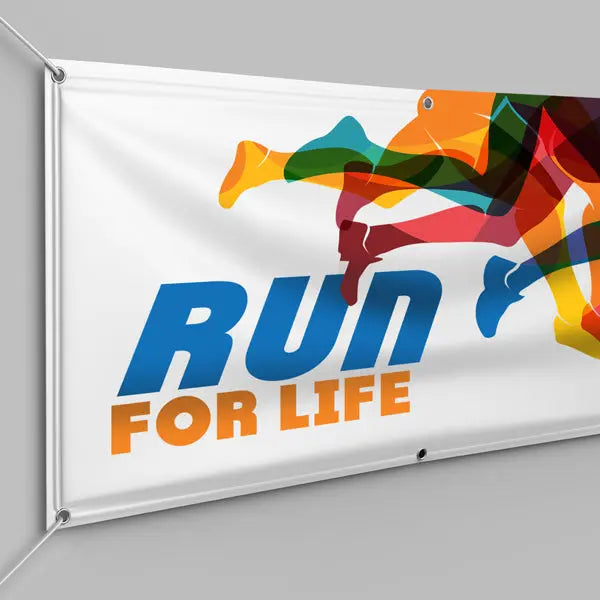 Run for Life event banner with colorful runner graphics and grommets along the edges.