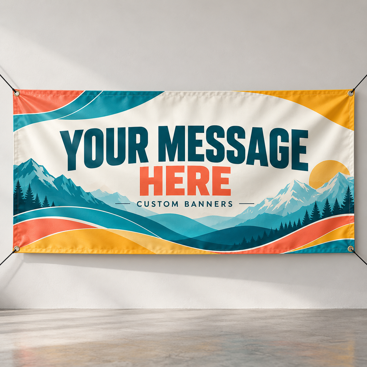 Mockup of a custom vinyl banner with mountain artwork, corner grommets and Your Message Here lettering.