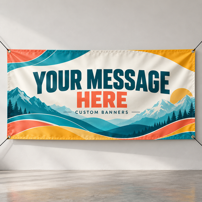 Mockup of a custom vinyl banner with mountain artwork, corner grommets and Your Message Here lettering.