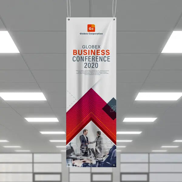 Vertical business conference banner hanging from the ceiling indoors.