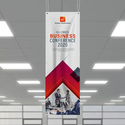 Vertical business conference banner hanging from the ceiling indoors.