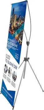 Angled view of a printed X banner display and its rear support legs.
